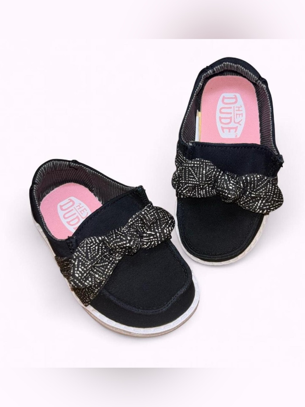 HEYDUDE Wendy Bow Essentials slip-on shoes featuring a textile bow detail